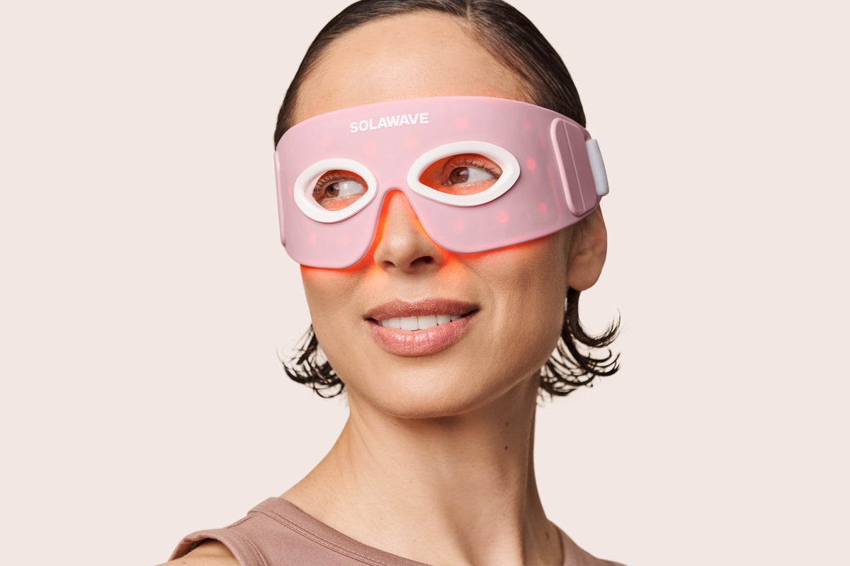 An image of a woman wearing the Solawave red light therapy eye mask