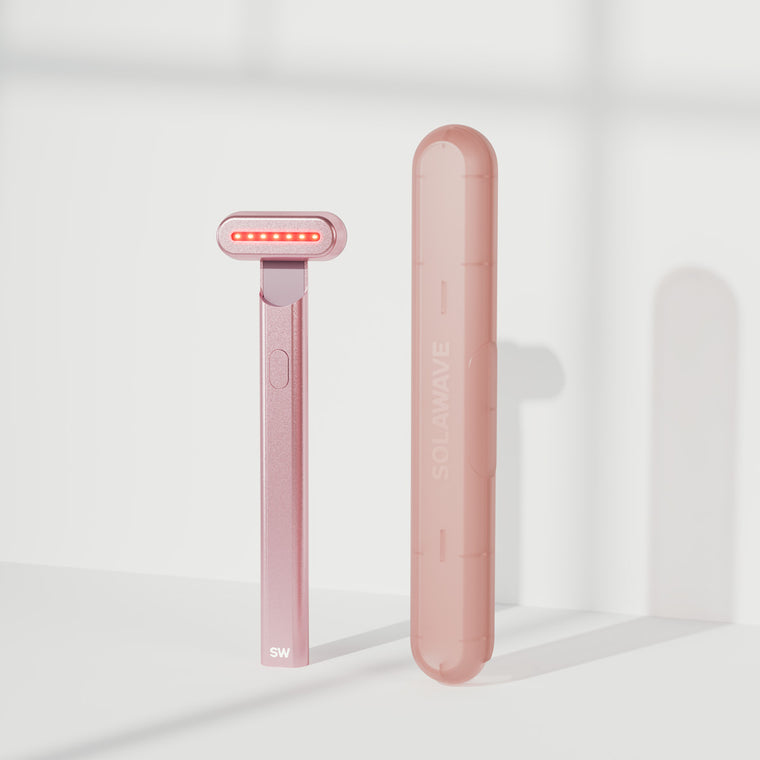 An image of a Solawave red light therapy wand with a travel case || Rose Gold