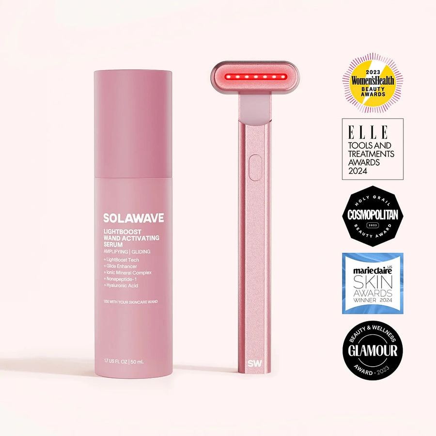 A rose gold SolaWave [BINAERY] 4-in-1 Radiant Renewal Skincare Wand stands by a serum bottle, highlighting advanced skin technology for reducing fine lines. Award badges from leading magazines are displayed to the right. || Rose Gold