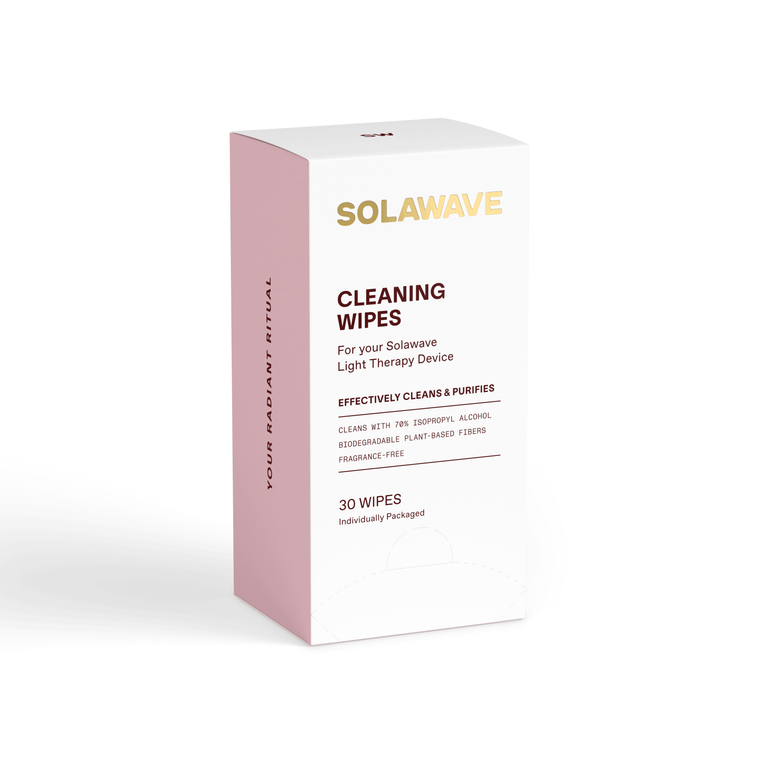 A white and pink box of Solawave Light Therapy Device Cleaning Wipes contains 30 individually wrapped, biodegradable wipes with 70% isopropyl alcohol and plant-based fibers, designed for use with your Solawave device.